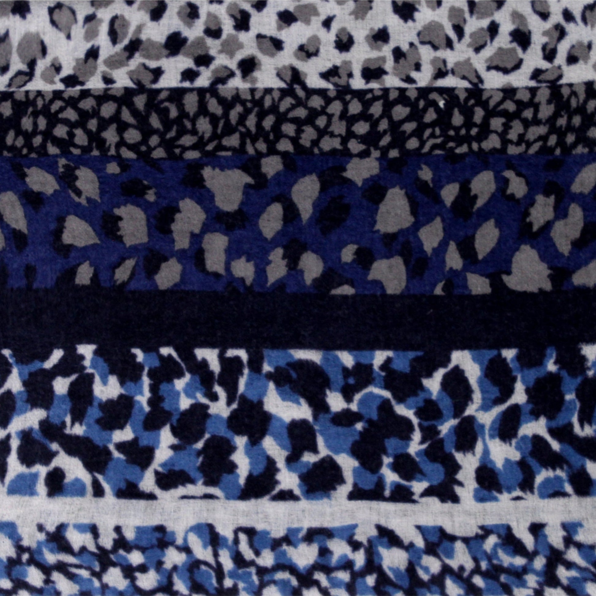 Close-up of soft blue wool cashmere fabric with leopard print texture