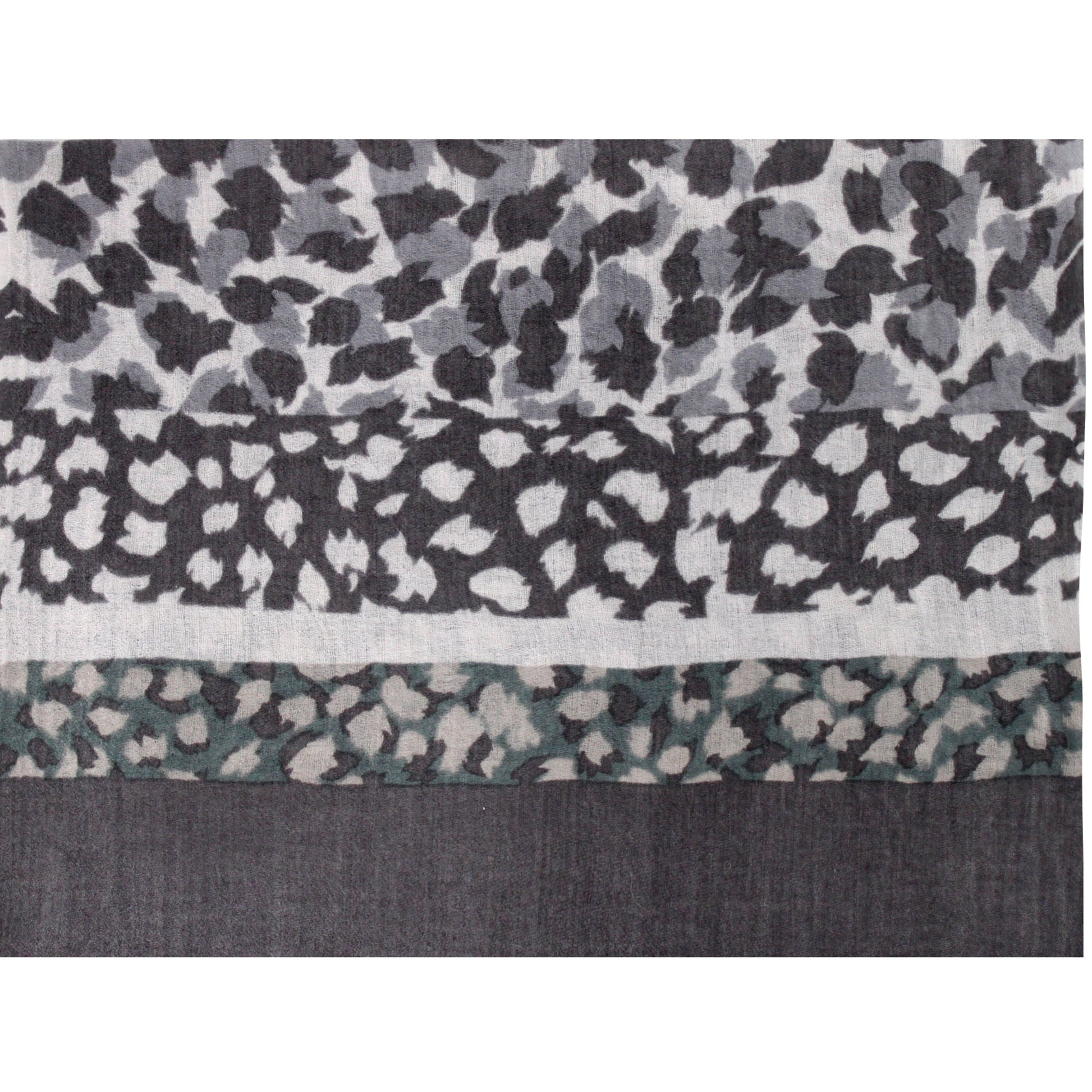 Close-up of soft gray wool cashmere fabric with leopard print texture